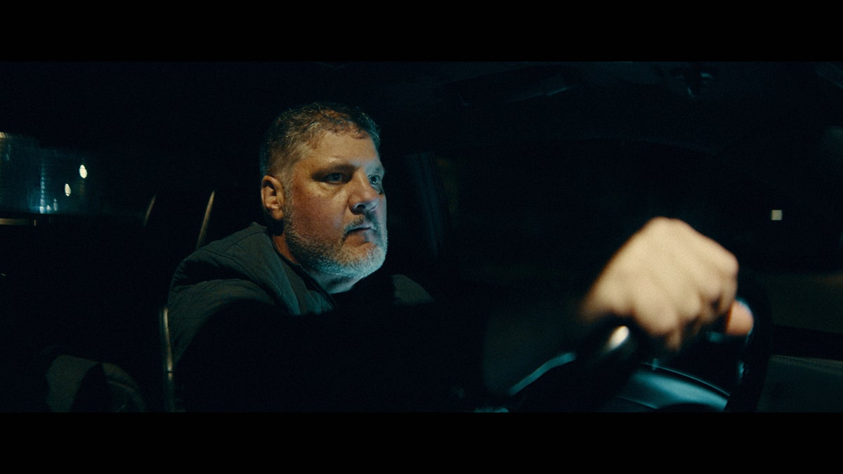 An investigator in the Sarah Pender case driving a car.