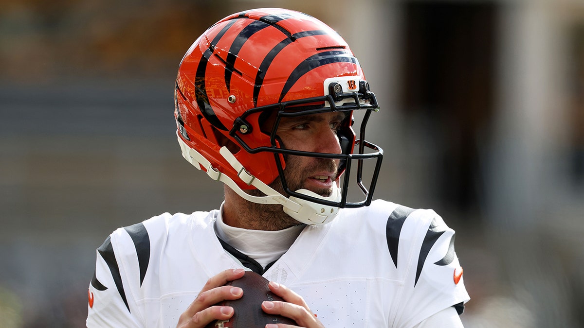 Cincinnati Bengals quarterback Joe Flacco warming up on the field at Acrisure Stadium in Pittsburgh