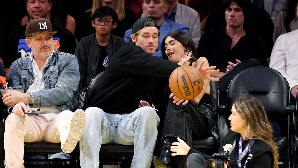 Justin Herbert and Madison Beer courtside at an NBA game