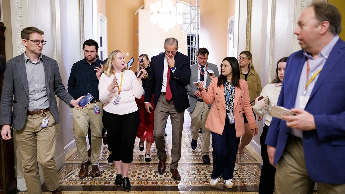 Senate Majority Leader John Thune speaking to reporters in the Ohio Clock Corridor on Capitol Hill.