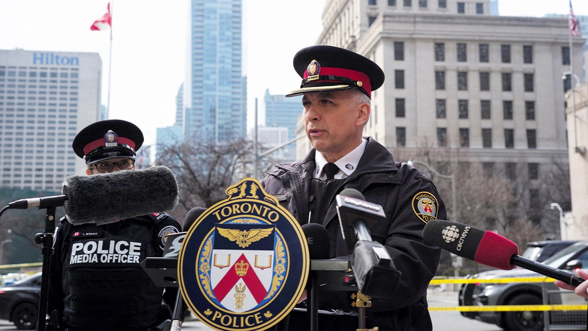 A Toronto police official addresses reporters during a press briefing about a firearm incident at a U.S. diplomatic site.
