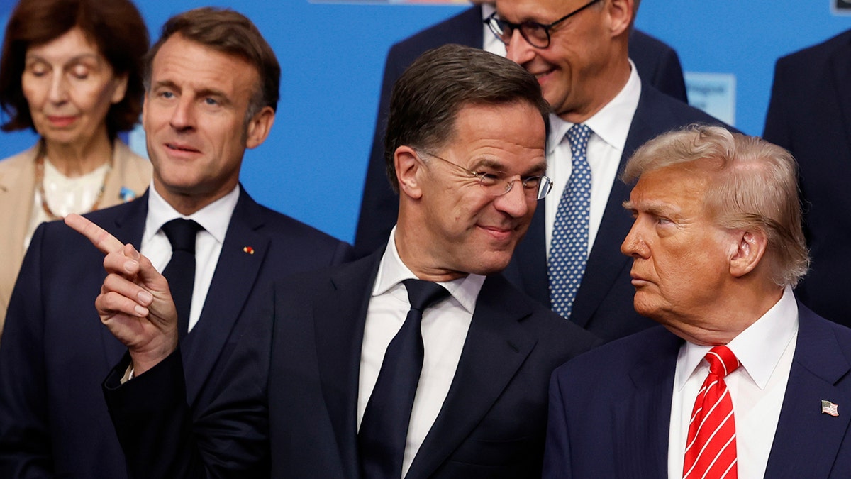 Rutte smiles at Trump during NATO photo