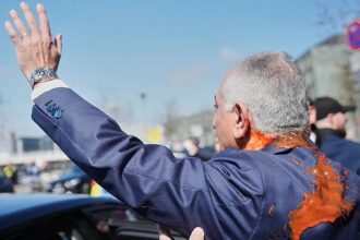 Iran’s exiled crown prince splattered with red liquid in Berlin