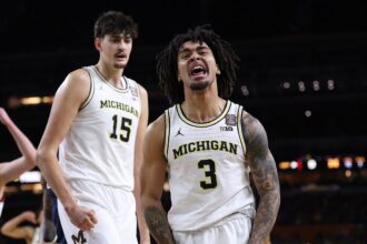 Michigan holds off UConn to capture first men’s basketball national title since 1989