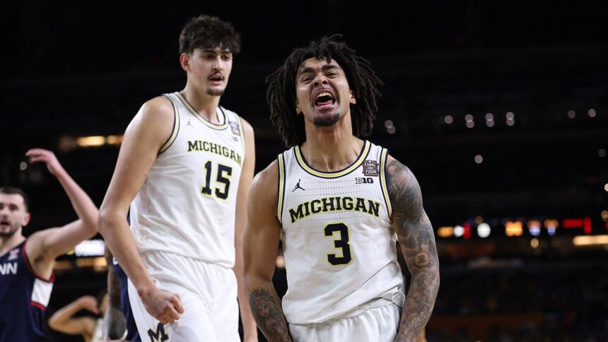 Michigan holds off UConn to capture first men’s basketball national title since 1989
