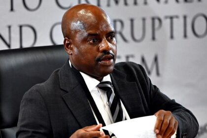 South African ex-police chief gets tissue stuck on forehead while sweating during corruption inquiry