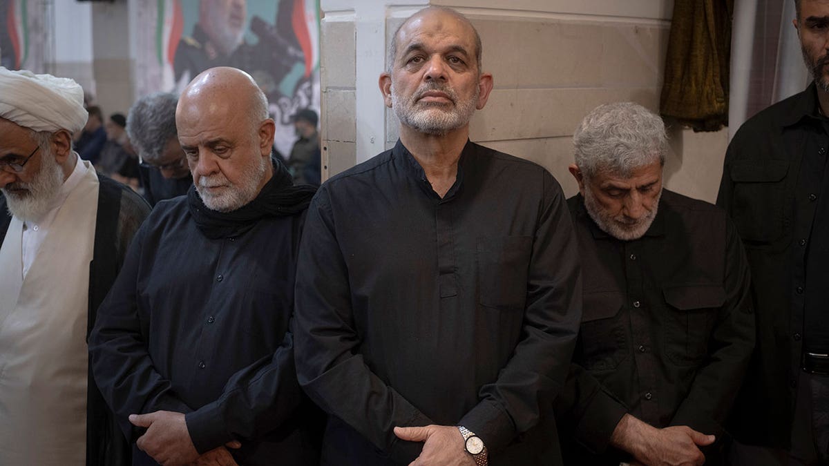 Ahmad Vahidi and Esmail Qaani standing at a ceremony in a mosque in Tehran