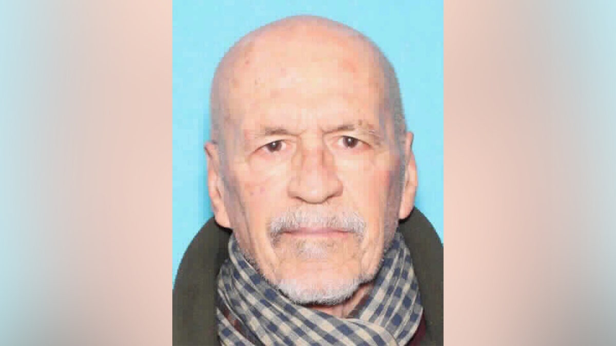 Anthony Chavez standing outdoors wearing a blue jacket