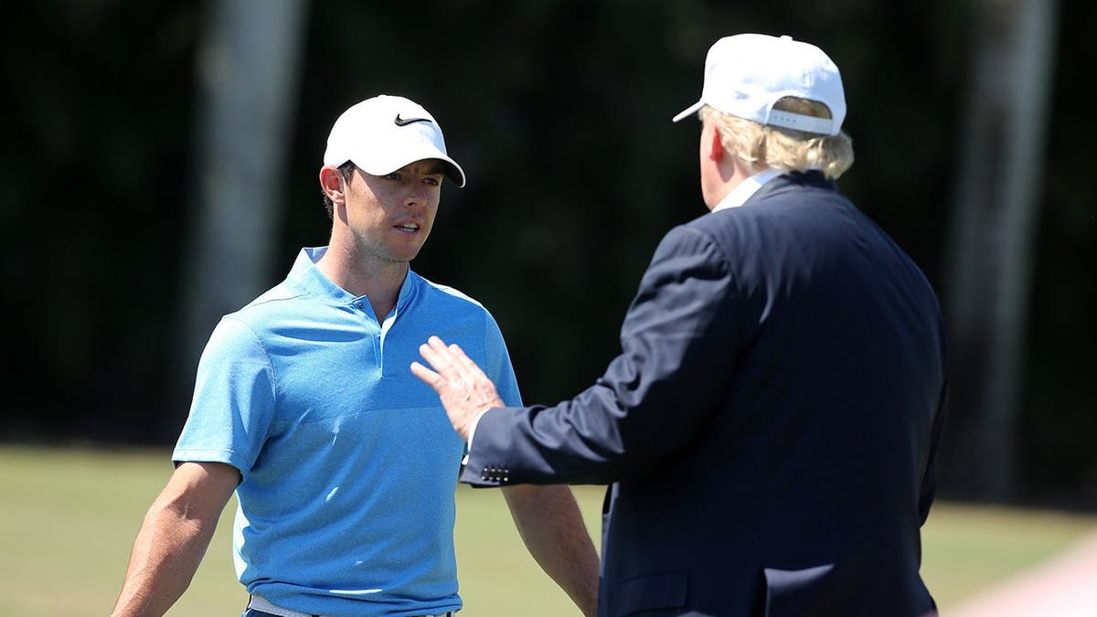 Donald Trump speaking with golfer Rory McIlroy at Trump National Doral Blue Monster Course