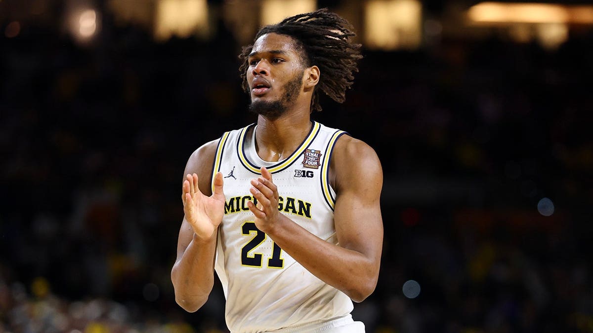 Morez Johnson Jr. celebrating after scoring a basket.