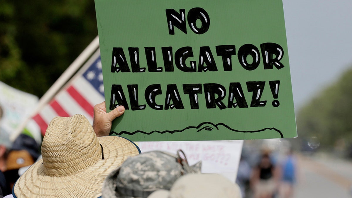 Environmental advocates protest against the "Alligator Alcatraz" ICE detention center being constructed at the Dade-Collier Training and Transition Airport in Ochopee, Fla., Saturday, June 28, 2025.