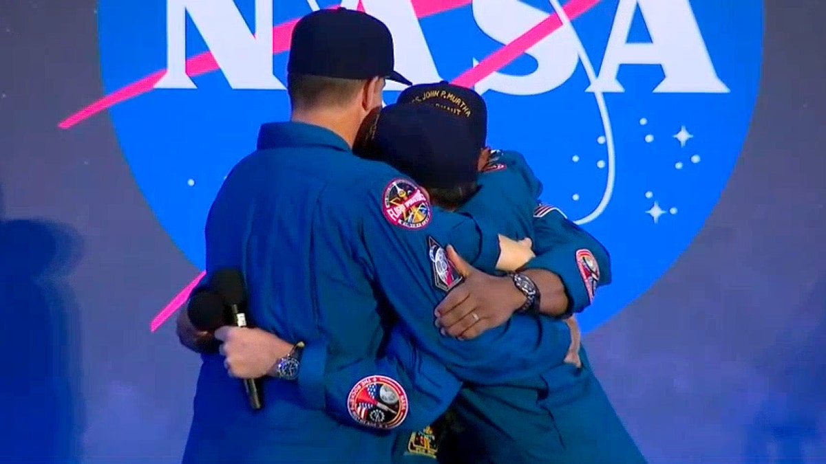 Artemis II crew hugging