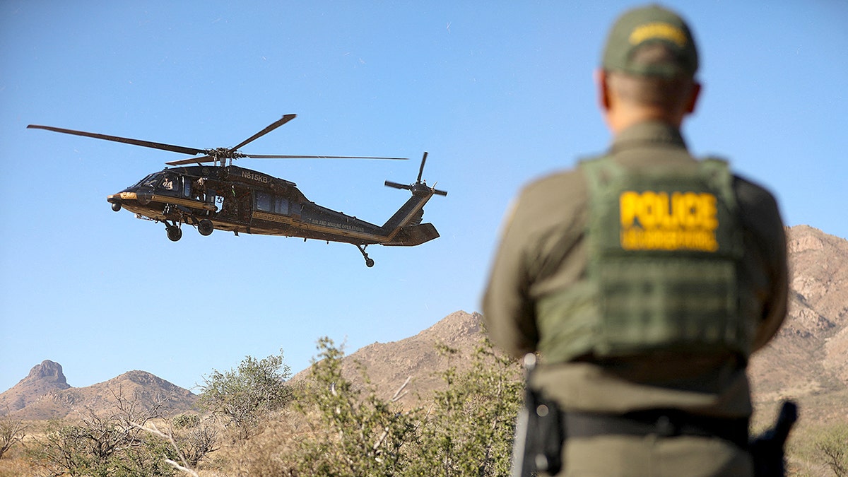 Border Patrol agents performing a rescue demonstration in the Brown Canyon desert near Sasabe, Arizona