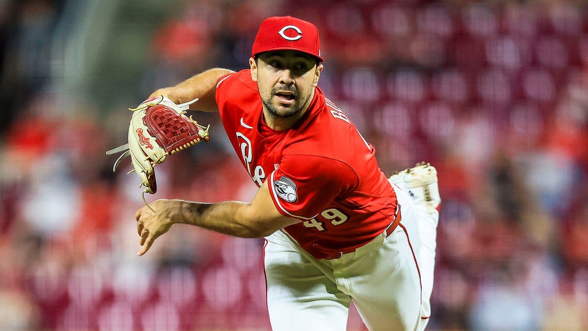 Cincinnati Reds relief pitcher Brock Burke pitching during a baseball game
