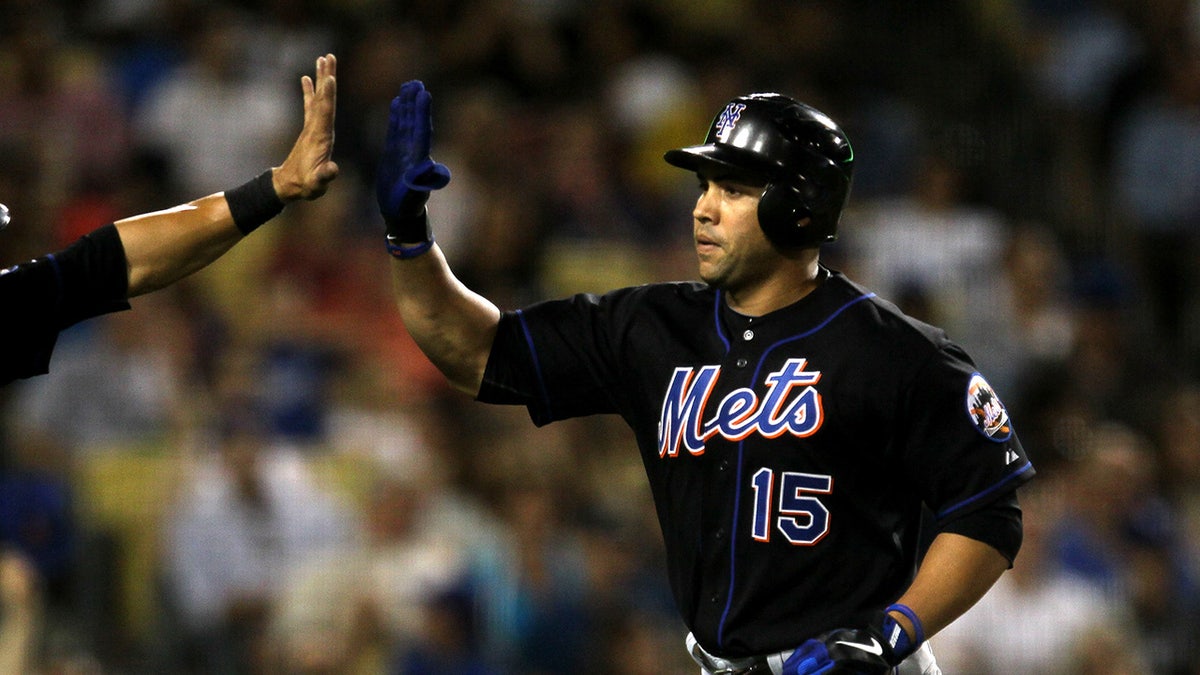 Carlos Beltran and Angel Pagan celebrating at Dodger Stadium after a home run.
