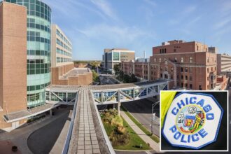 Two police officers shot during prisoner transport at Chicago hospital, suspect in custody