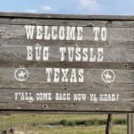 Some passing motorists can’t keep their hands off the town signs in Bug Tussle, Texas