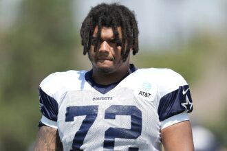 Former Cowboys player Trysten Hill appears to grin after arrest tied to alleged assault of pregnant woman