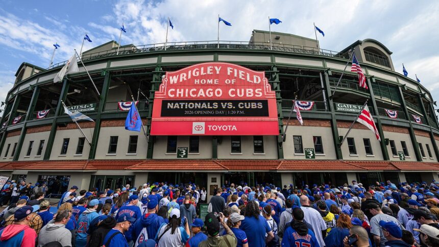 Fan spotted with laptop, apparently logging work hours from Wrigley Field stands during Cubs day game