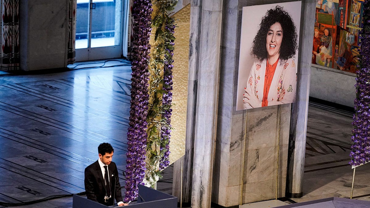 Ali Rahmani speaking at Oslo City Hall during Nobel Peace Prize ceremony