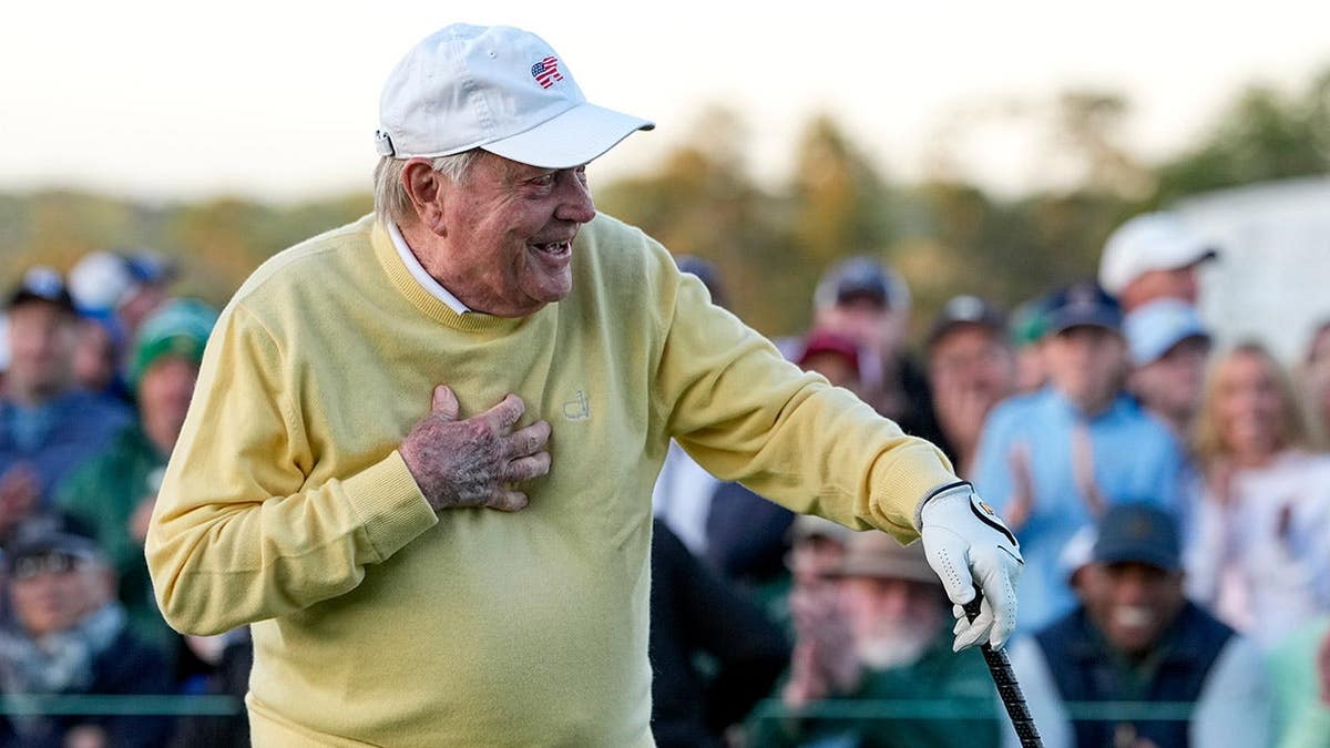 Jack Nicklaus hitting a ceremonial tee shot on the first hole at Augusta National Golf Club
