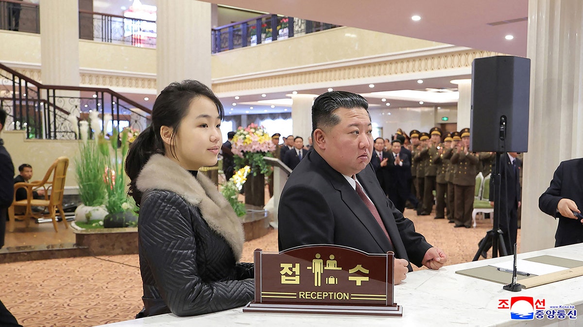 This picture taken on December 20, 2025, and released by North Korea's official Korean Central News Agency (KCNA) via KNS on Dec. 23, 2025, shows North Korean leader Kim Jong Un (R) and his daughter Ju Ae (L) inspecting the Milyong Hotel, which was recently completed in the Samjiyon tourist district of Ryanggang Province.