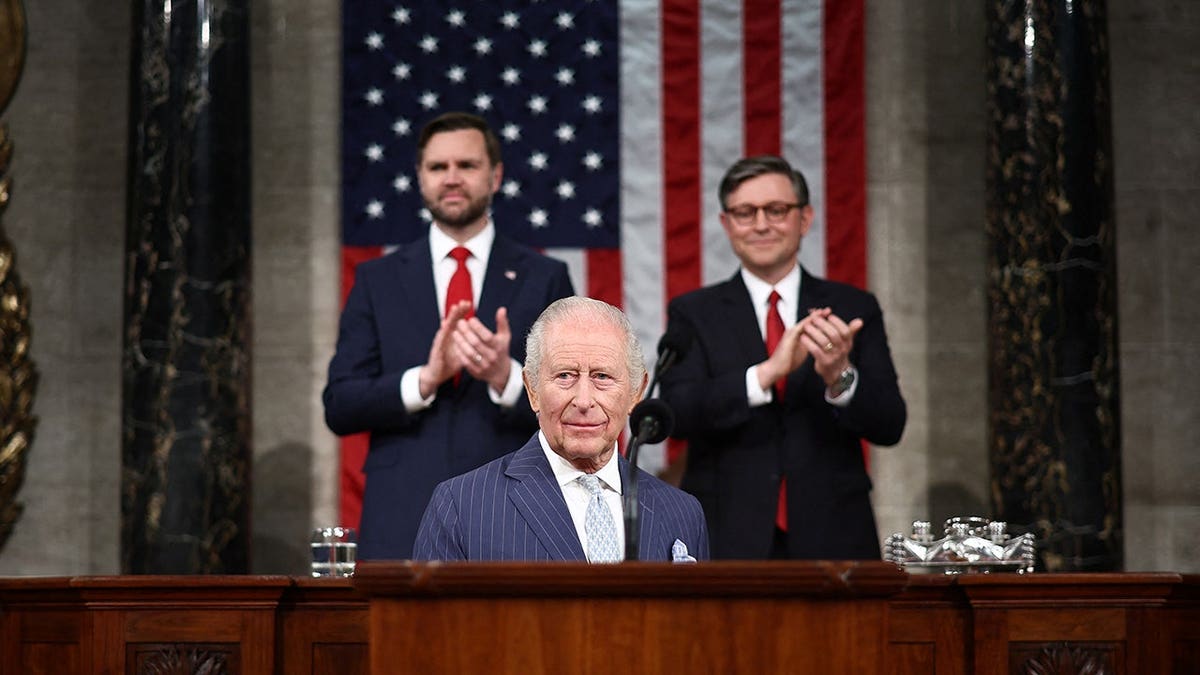 King Charles addressing Congress with Speaker of the House Mike Johnson and Vice President J.D. Vance behind him in April 2026.