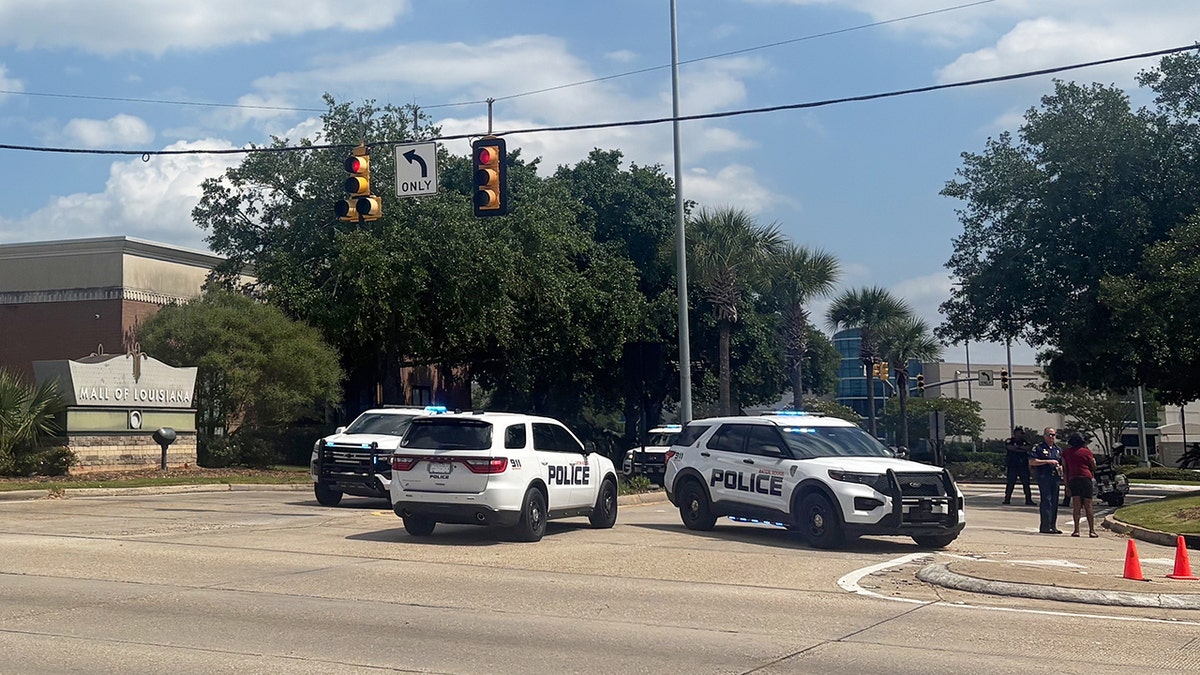 Police outside the Mall of Louisiana after a mass shooting.