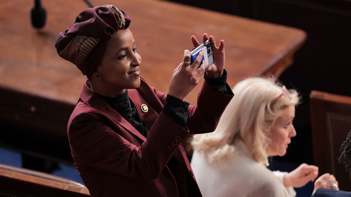 ilhan omar taking photo of king charles during address