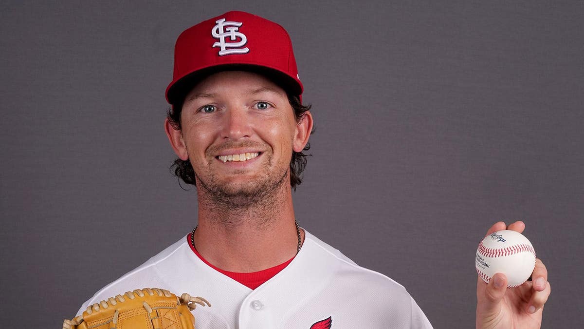 St. Louis Cardinals pitcher Packy Naughton standing on the field.