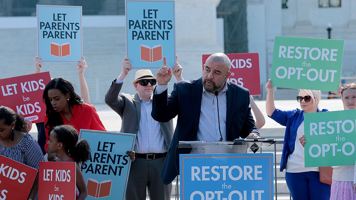 Parents from Montgomery County Public Schools outside Washington, D.C., protest outside the United States Supreme Court.
