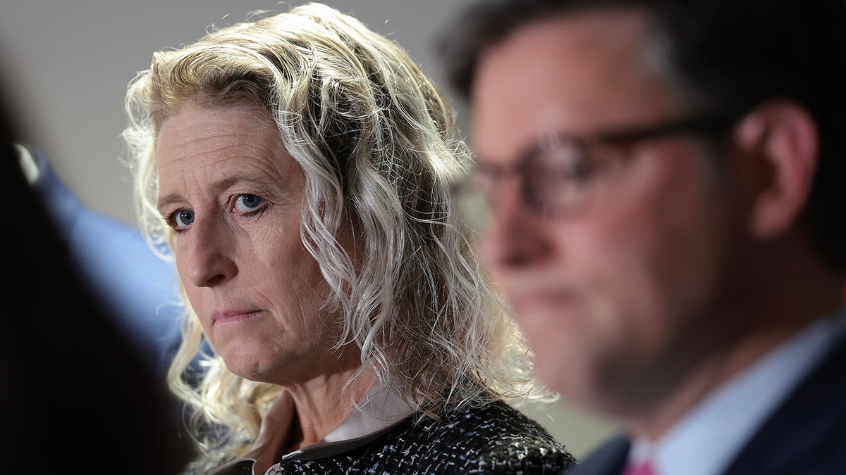 Rep. Jen Kiggans standing at a press conference on Capitol Hill