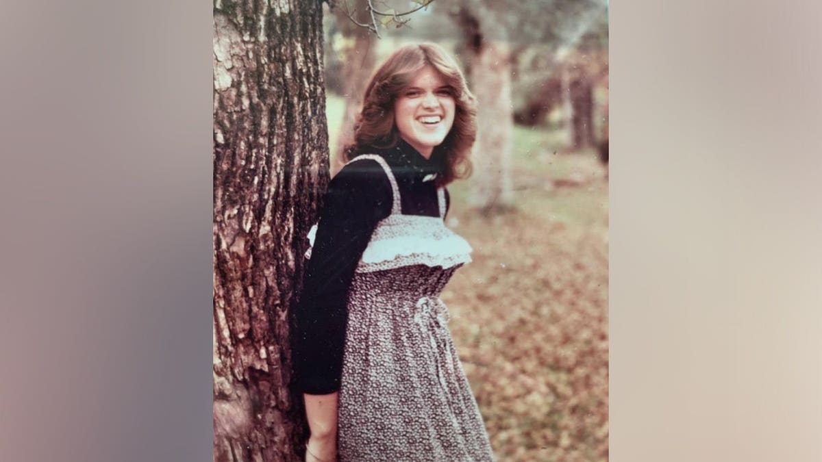 Susan Vesey standing in front of a house in Everett Washington