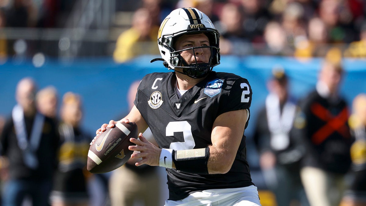 Vanderbilt quarterback Diego Pavia throws a pass during a football game.