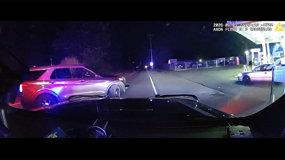 Police vehicles block roadway during high speed chase of stolen car in Thurston County Washington