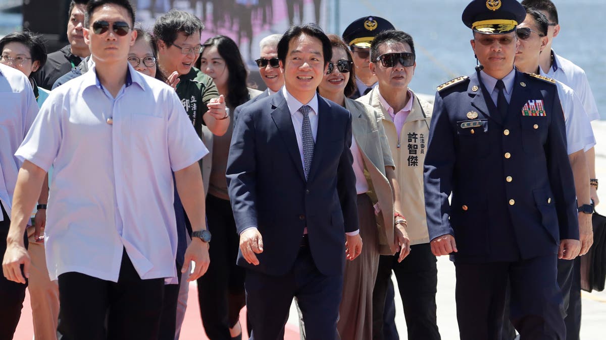 Taiwanese President Lai Ching-te walking before an offshore anti-terrorism drill at Kaohsiung harbor