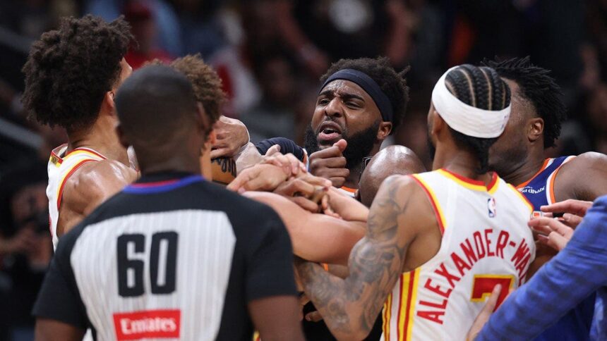 Two players ejected after scrum amid Knicks’ 50-point lead against Hawks sends referee crashing to the court