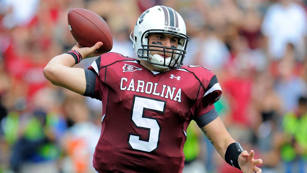 South Carolina quarterback Stephen Garcia throwing a pass during a football game.