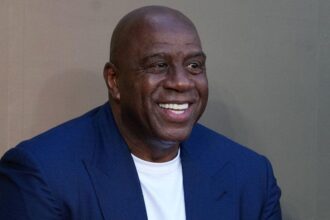 NBA legend Magic Johnson breaks from his former Lakers boss to endorse Karen Bass in LA mayoral race