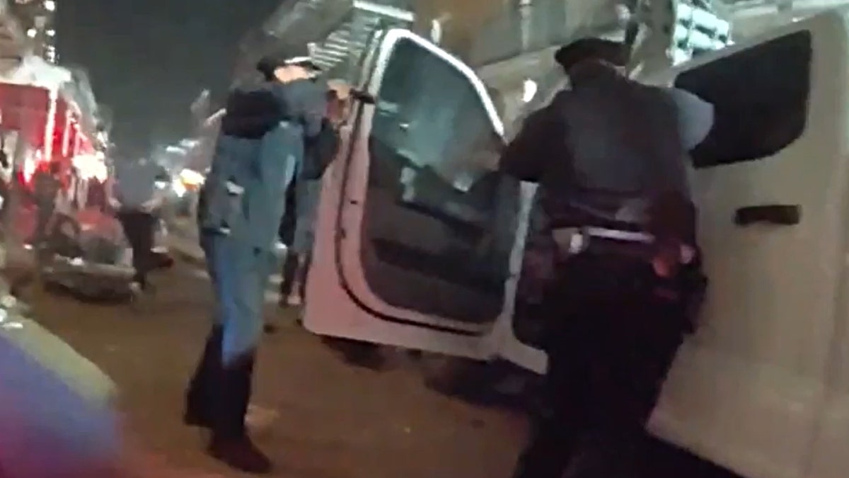 New Orleans police confronting Shamsud-Din Jabbar on a street.