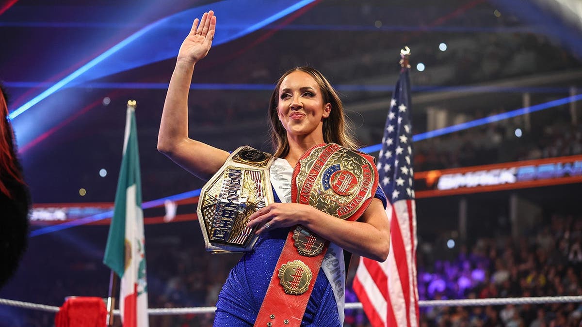 Chelsea Green waving during SmackDown at Ball Arena in Denver, Colorado