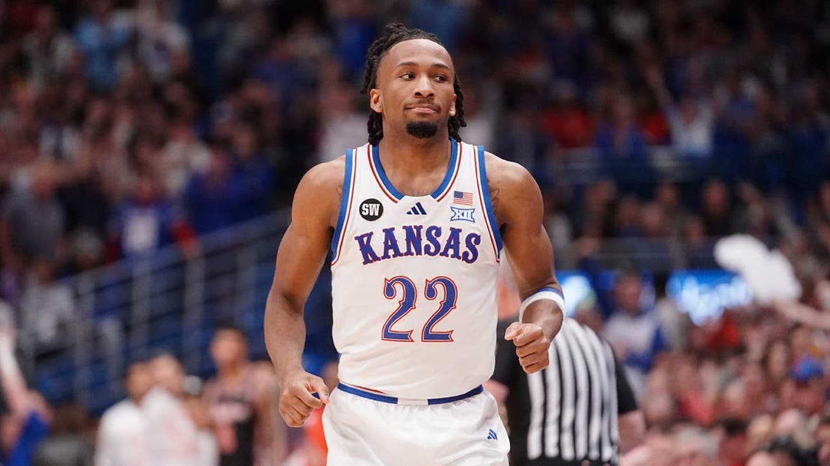 Kansas Jayhawks guard Darryn Peterson jogging back after making a three-pointer inside Allen Fieldhouse