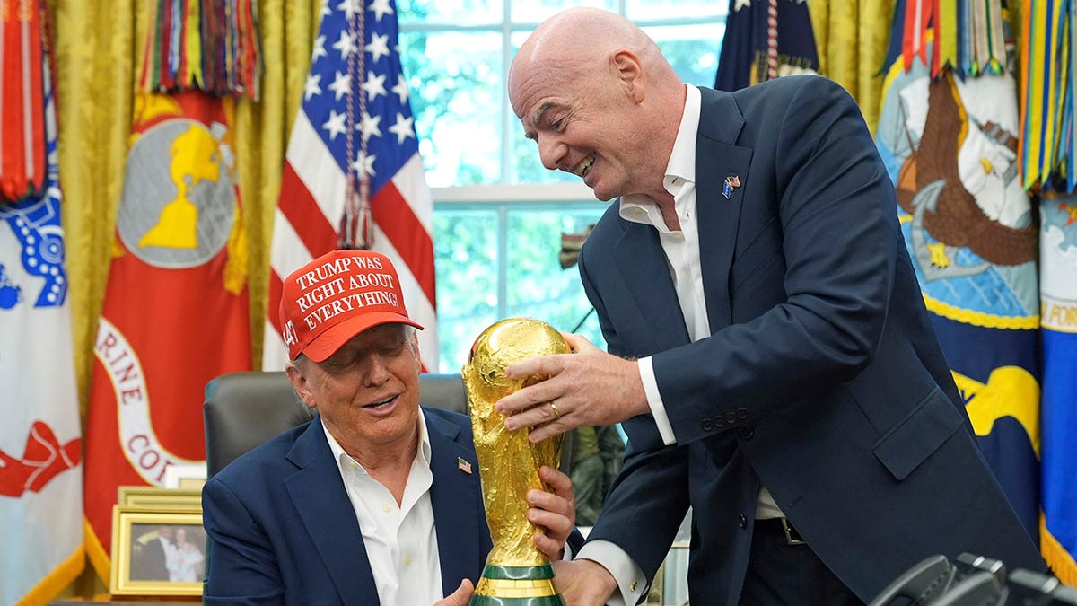 FIFA President Gianni Infantino handing FIFA World Cup Winners Trophy to President Donald Trump in Oval Office
