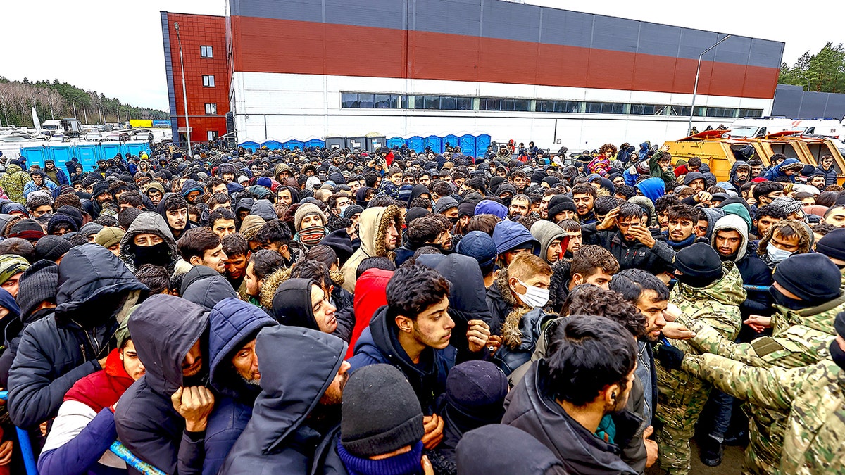 Illegal migrants by Polish border.