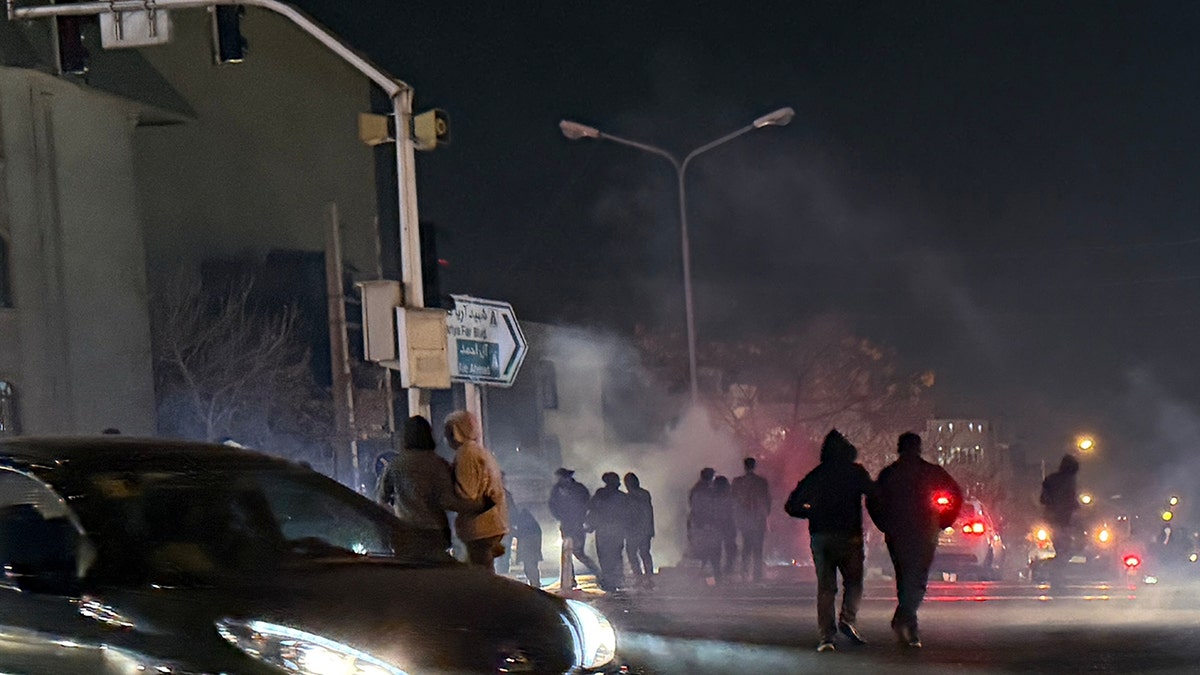 tear gas is fired during an anti-government in Iran