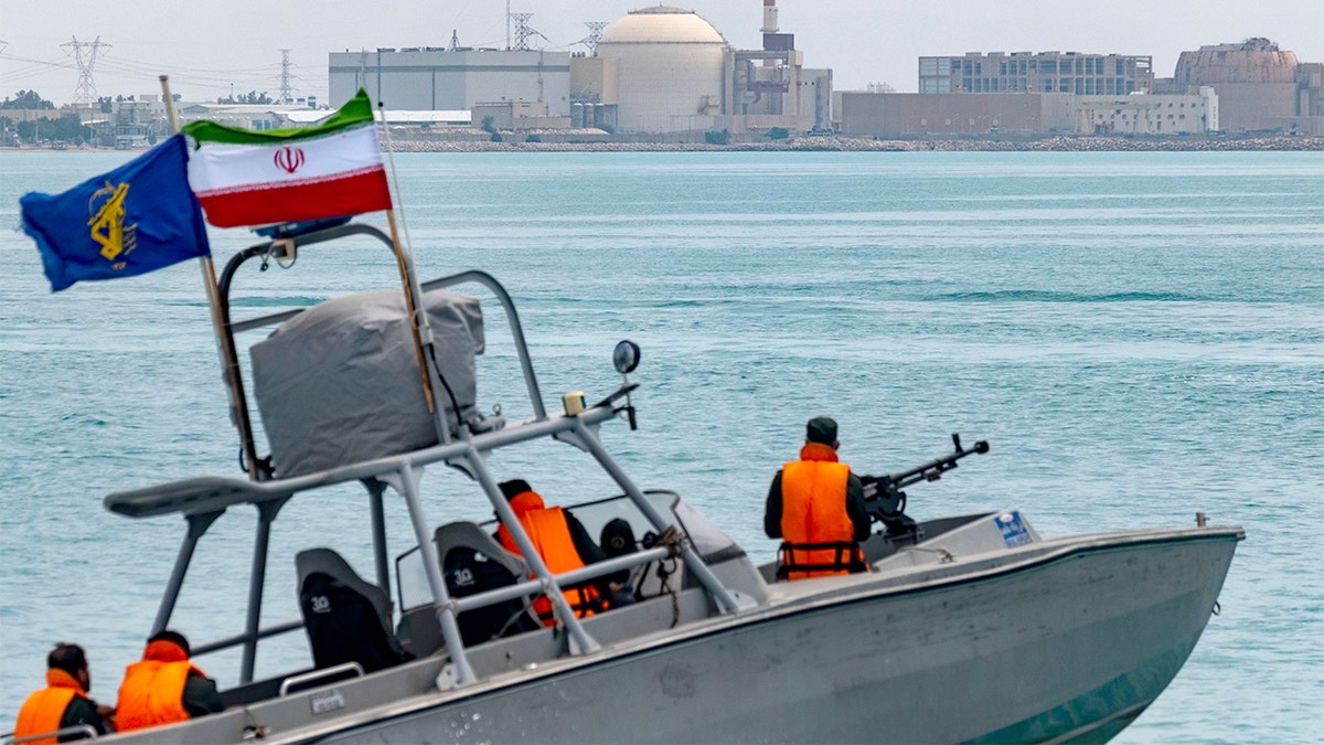 An Islamic Revolutionary Guard Corps speedboat sailing in the Persian Gulf near Bushehr nuclear power plant