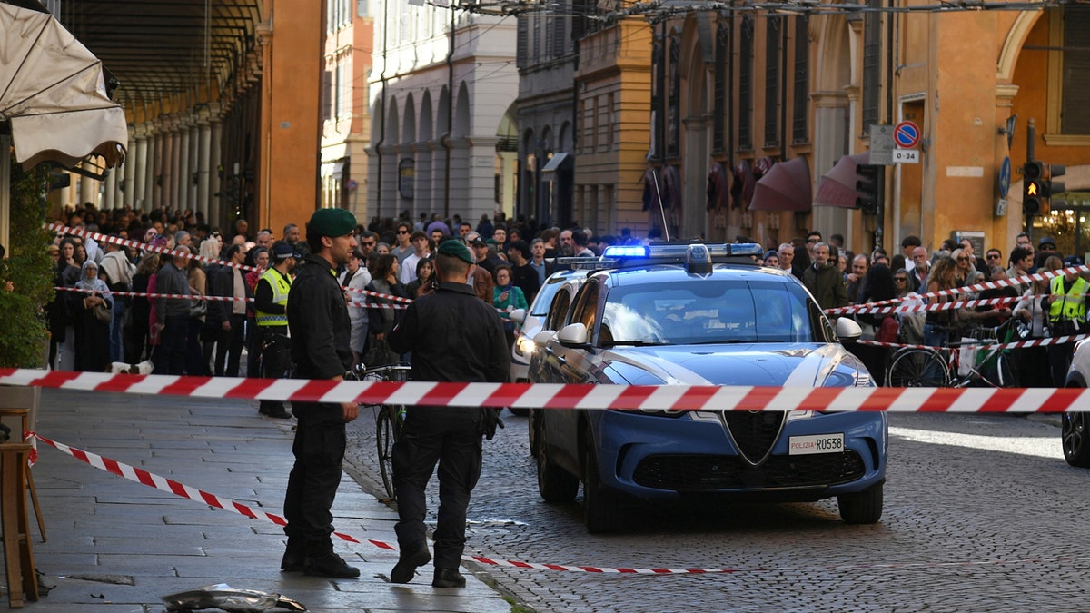 Financial Police patrol a scene after a car incident in a street of Modena, Italy.