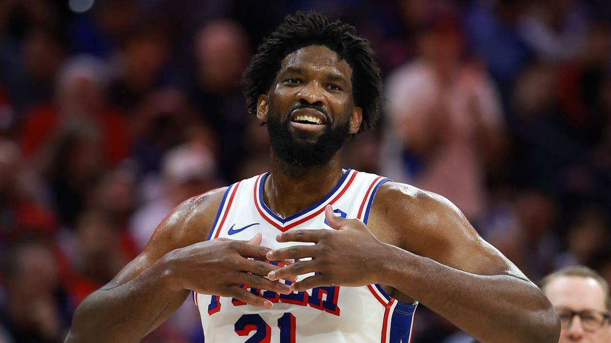 Joel Embiid wearing number 21 reacts during NBA playoff game at Xfinity Mobile Arena