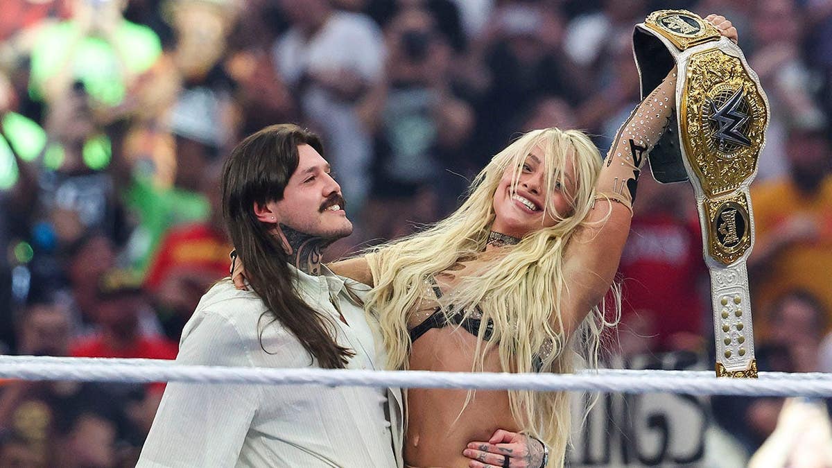 Liv Morgan celebrating with Dominik Mysterio after winning Women's World Championship at WrestleMania 42
