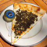 Philadelphia pizza shop sells  slices topped with caviar, served on gold plate with keepsake spoon